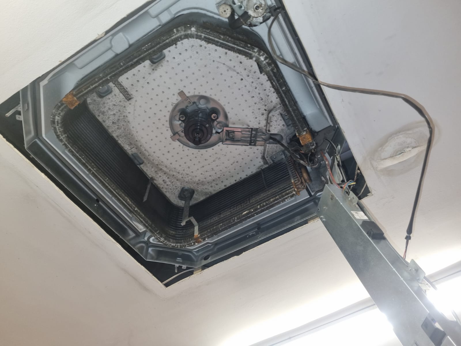 Daikin ceiling cassette — stripped for deep service