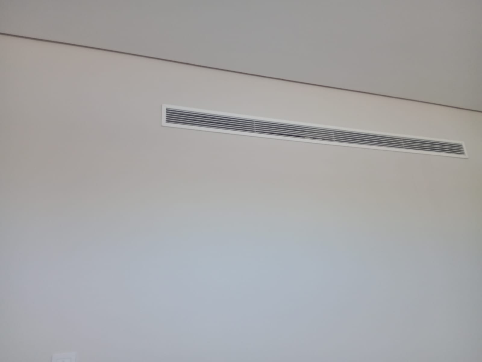 Linear bar grille — concealed bulkhead supply