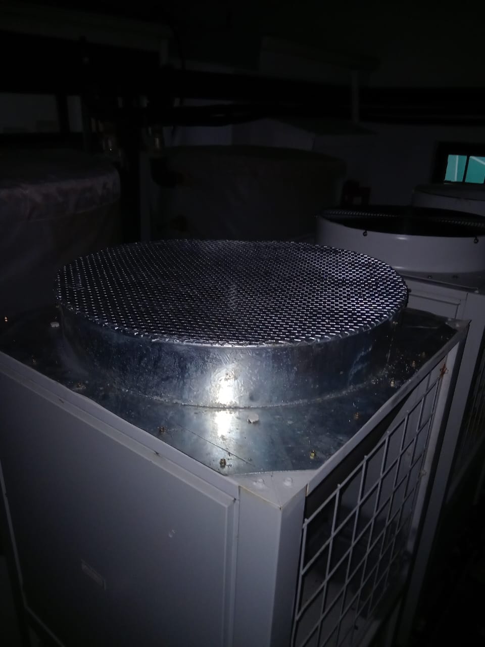 Custom condenser top hail-guard — perforated mesh on galvanised tray
