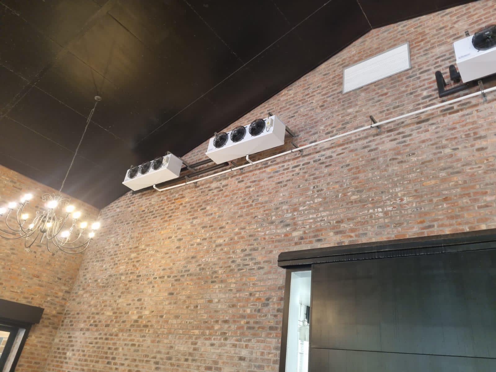 Wall-mounted evaporators with insulated glycol lines — tasting room